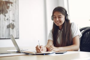 young-student-sitting-table-use-laptop